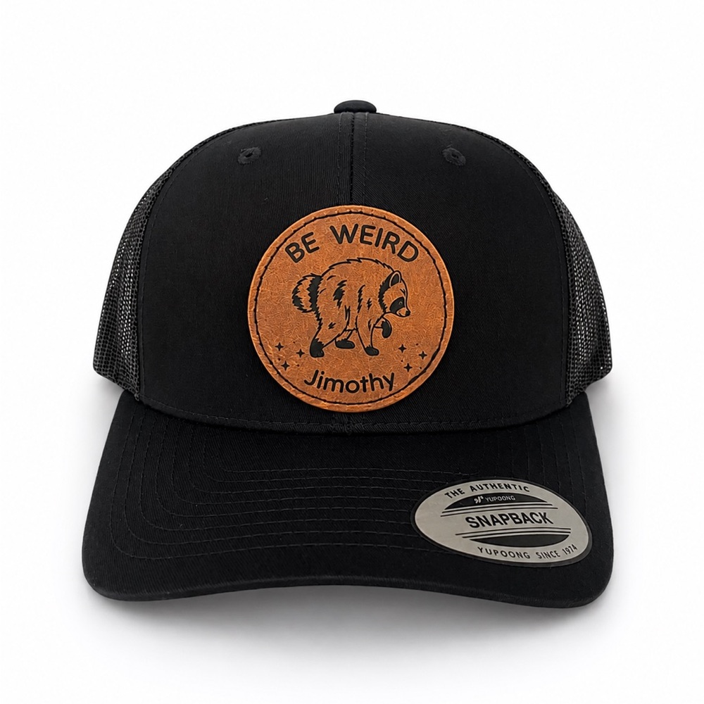 Moth Black Trucker Hat with Tan Leather 'Be Weird' Patch